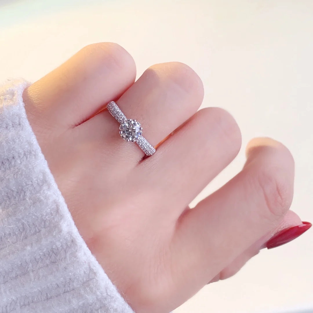 Prong-set lab-grown diamond ring with diamond-accented band