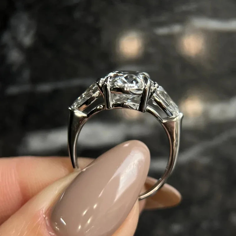 Oval-cut lab-grown diamond ring with pear side stones