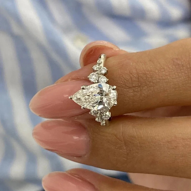 Pear-cut lab-grown diamond engagement ring with accent stones