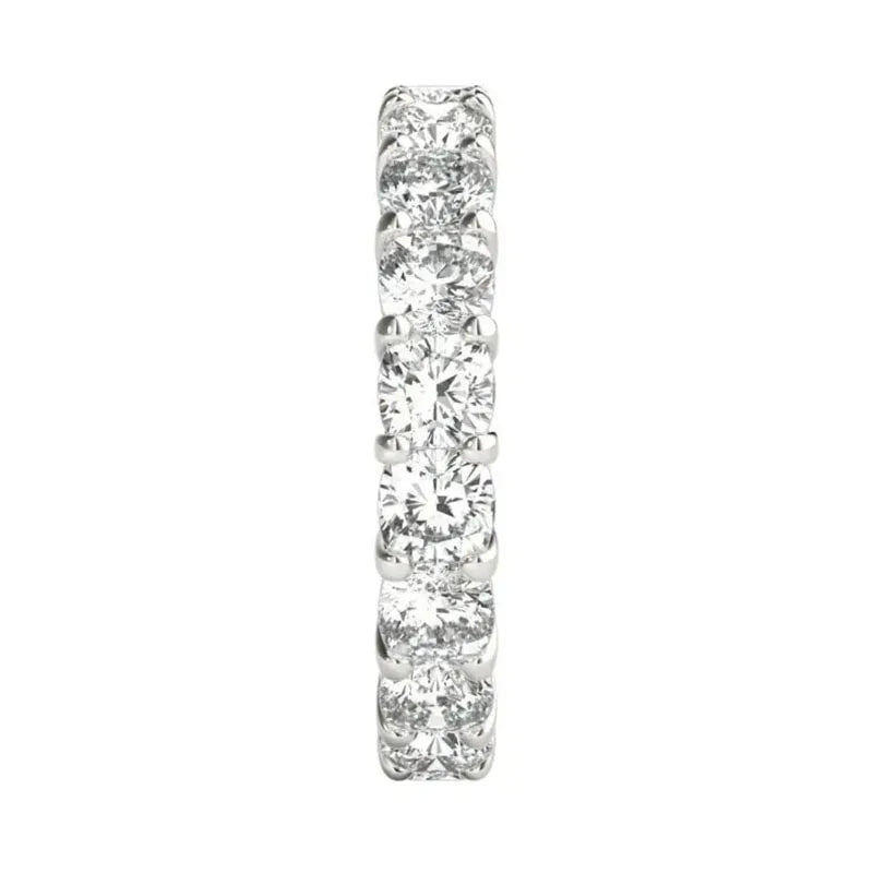Cushion diamond wedding band with prong-set stones
