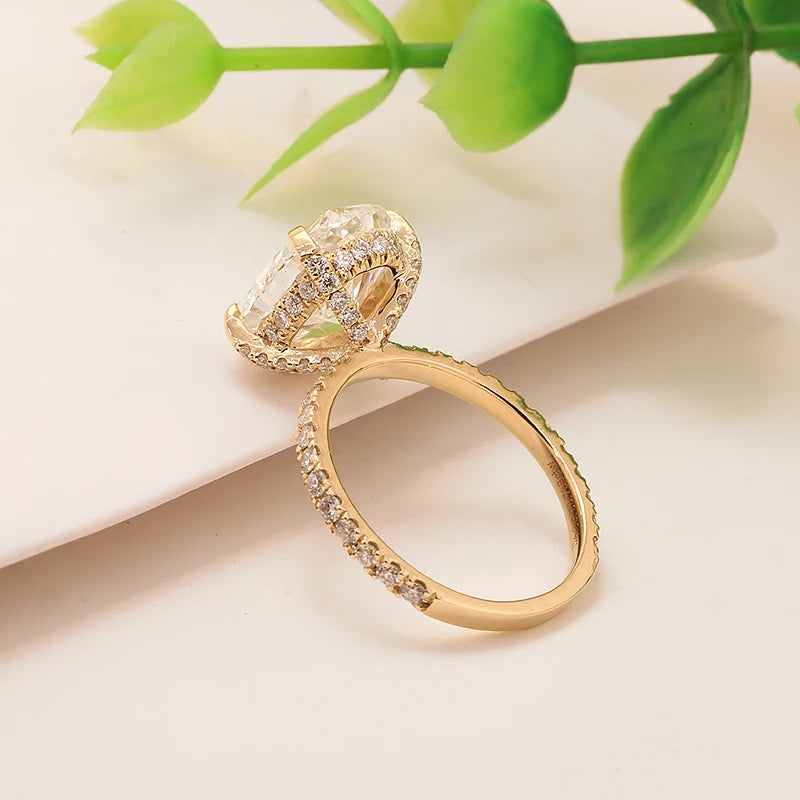 Oval-cut lab-grown diamond ring with diamond-accented setting