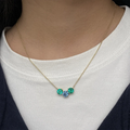 Blue round and emerald lab-grown diamond pendant necklace