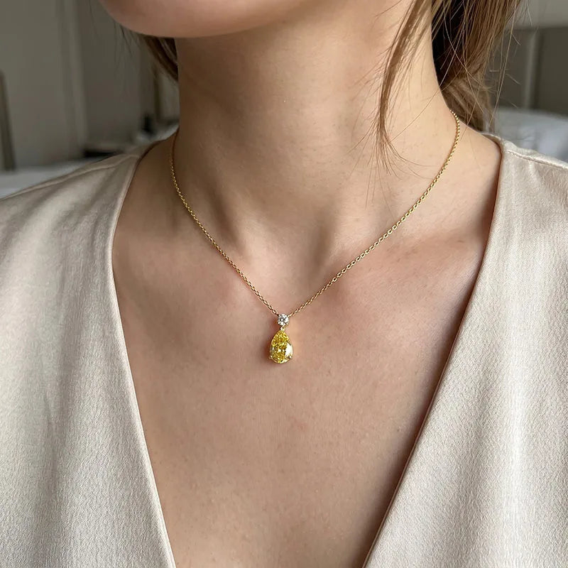Yellow diamond pendant with white diamond accent