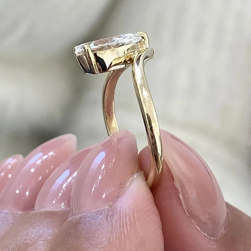 Pear-shaped lab-grown diamond ring with diamond accents