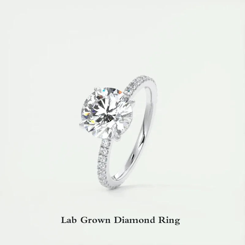 White gold engagement ring with round lab-grown center diamond and pavé accents