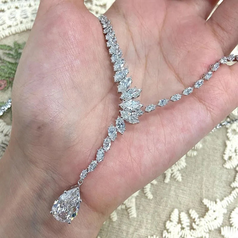 Pear diamond necklace with marquise-cut accents