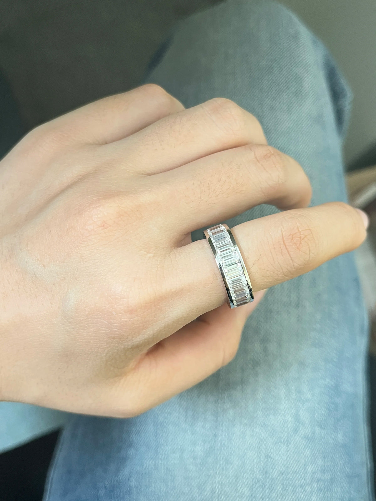 Step-cut emerald diamond engagement ring