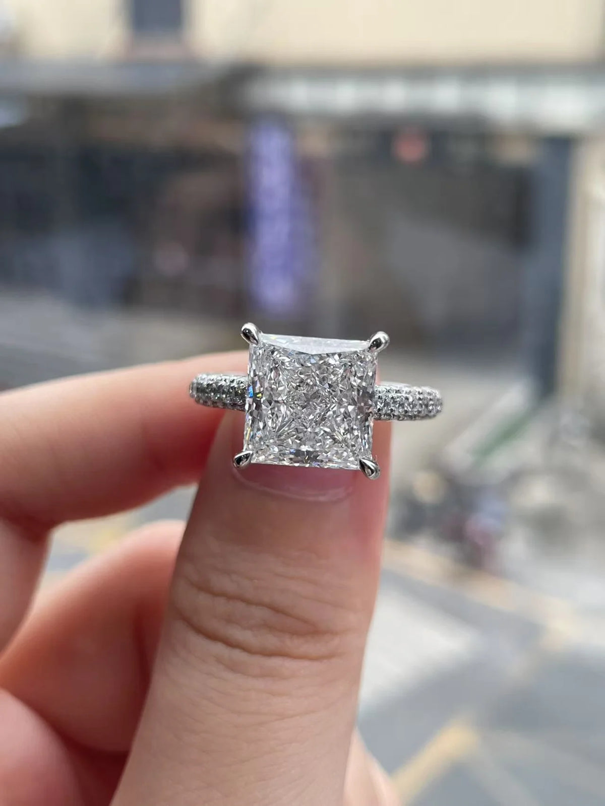Princess diamond ring with round accent diamonds