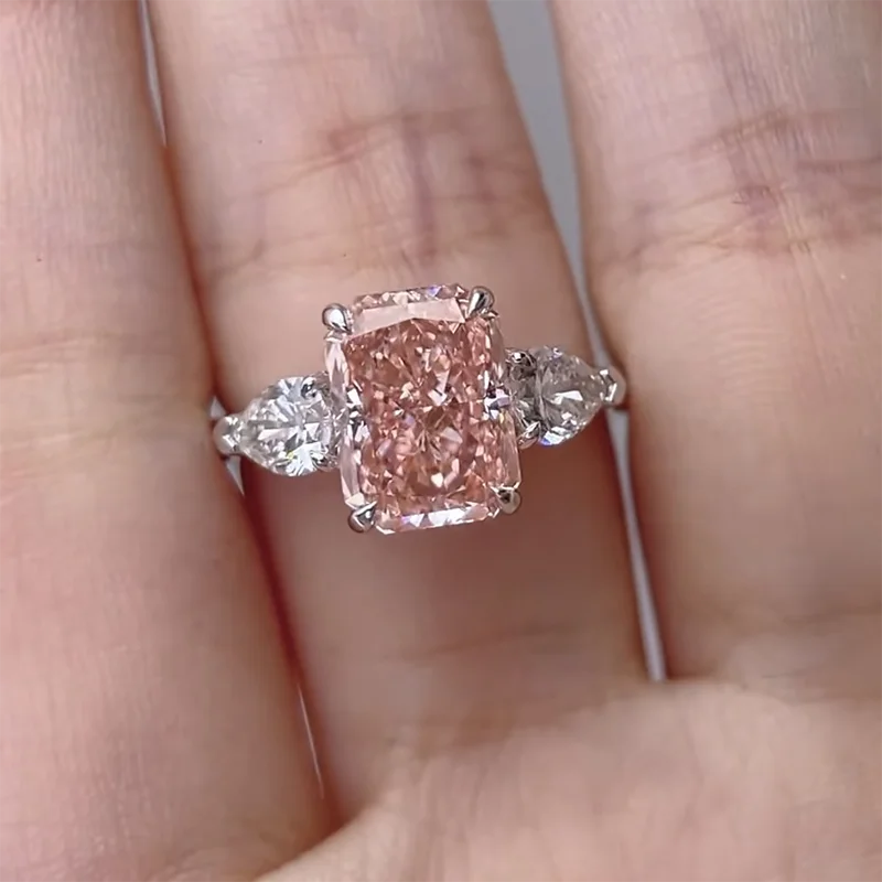 Pink diamond three-stone engagement ring