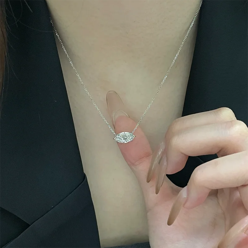 Marquise diamond pendant with small diamond accents