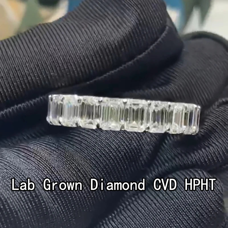 Gold emerald diamond eternity ring