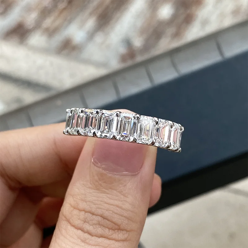 Gold nine-stone emerald diamond wedding band