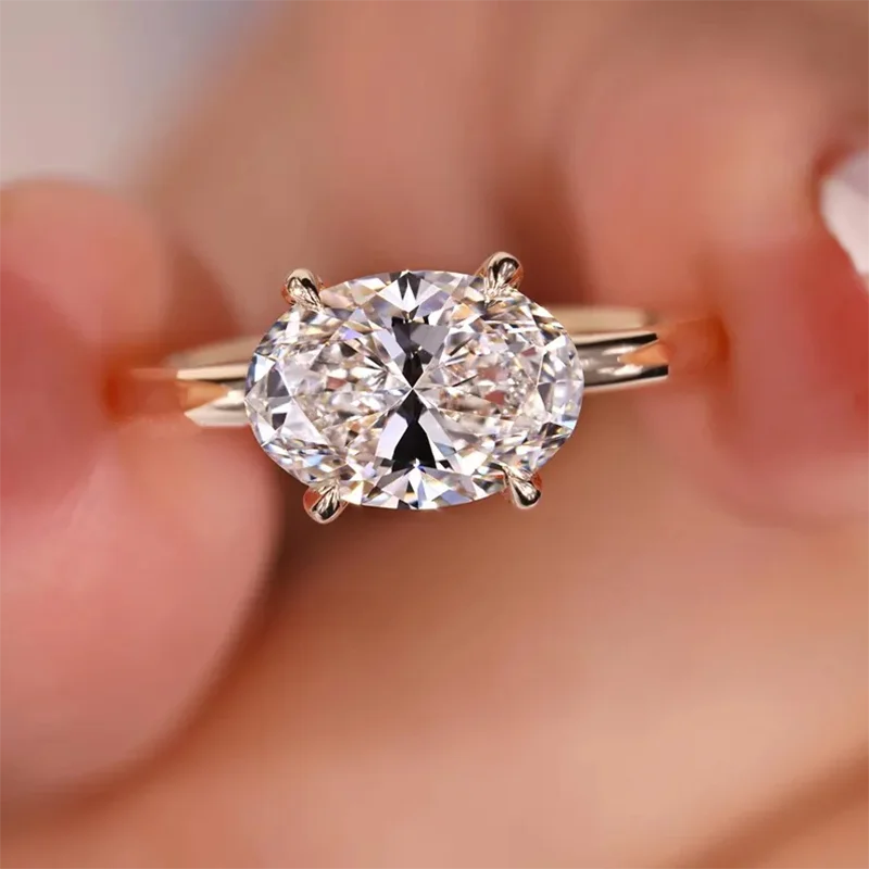 East-west oval diamond ring with accent stones