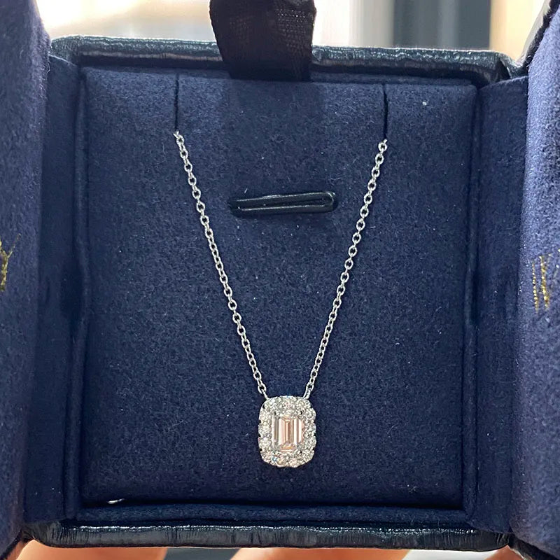 Emerald-cut diamond pendant with accent diamonds