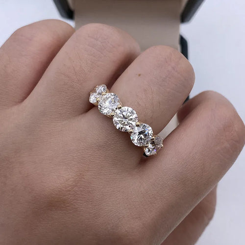 Five round lab-grown diamonds in gold anniversary ring