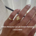 Yellow marquise lab-grown diamond three-stone engagement ring