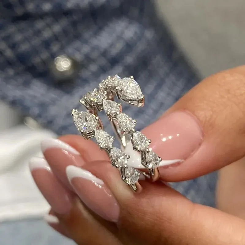 Lab-grown pear diamond engagement ring and coordinating bridal band