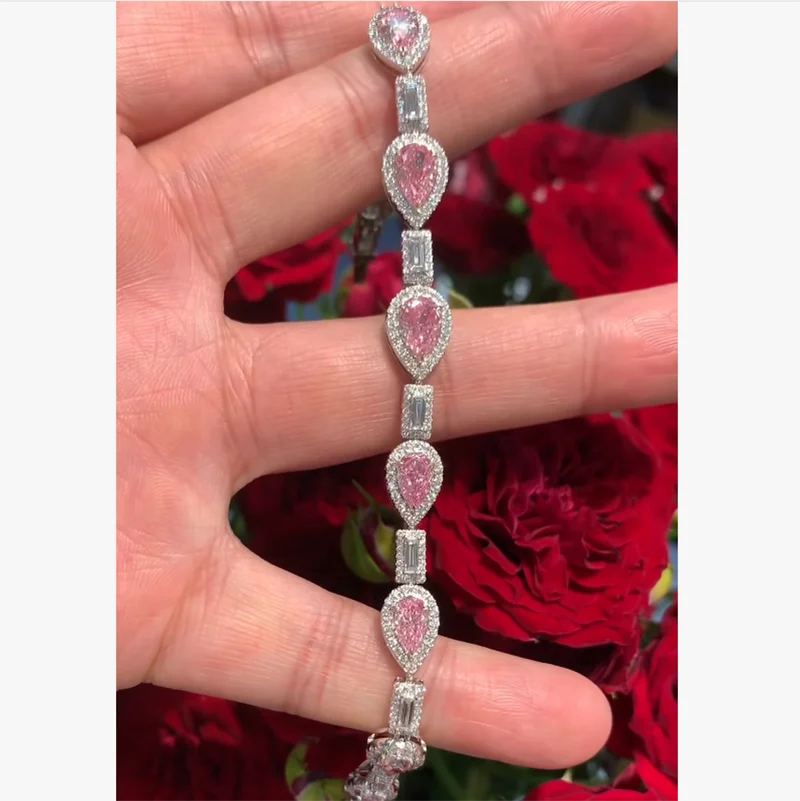 Pink pear emerald and round diamond bracelet