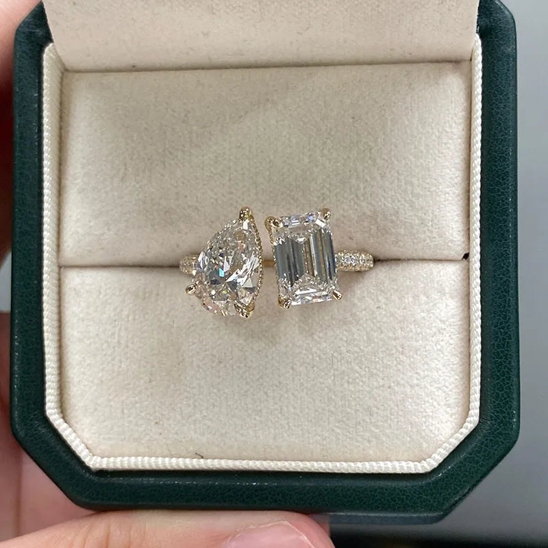 Gold ring with emerald-cut and pear-cut diamonds