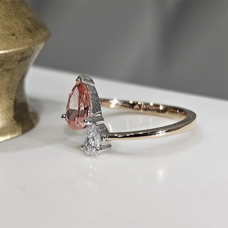 Two pear-cut lab-grown diamonds in engagement ring