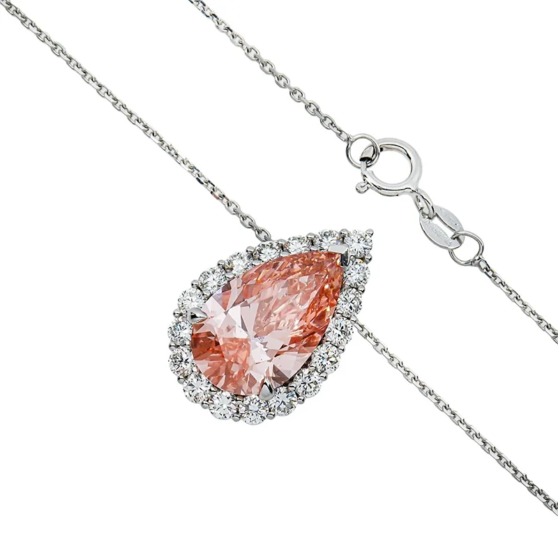 Pink pear-cut diamond pendant with round accents