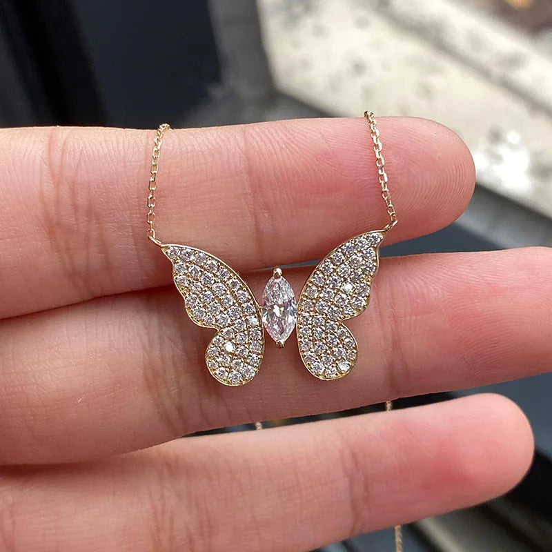 Diamond butterfly pendant with marquise and round stones