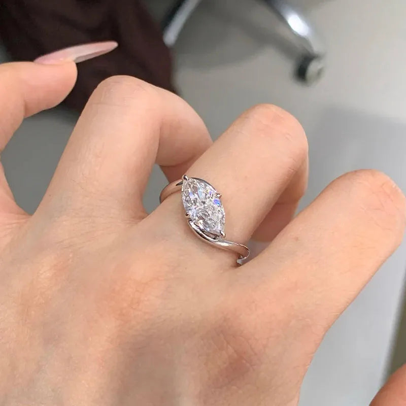 Marquise-cut diamond ring with sculptural band