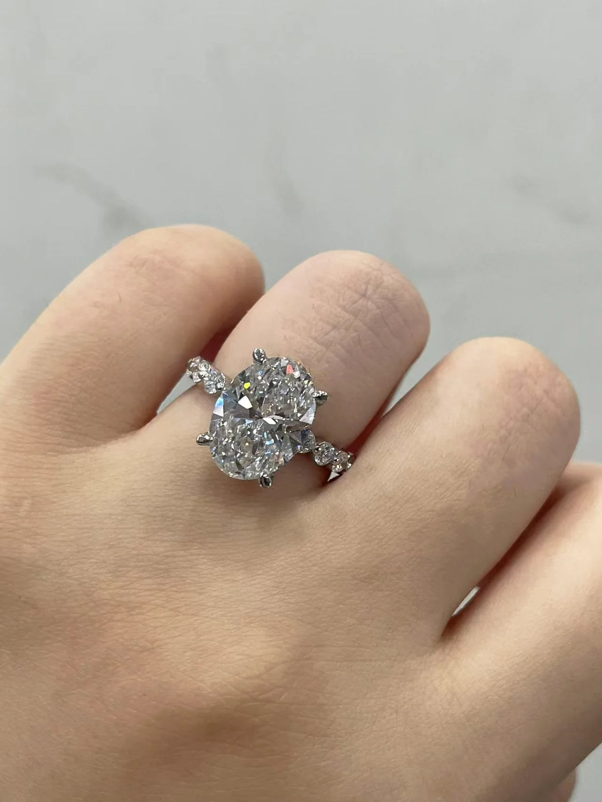 Lab-grown diamond accent ring featuring oval center
