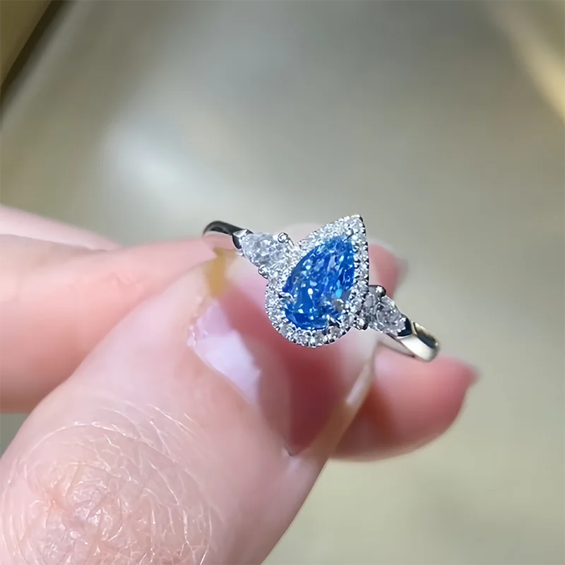 Three-stone blue pear diamond engagement ring