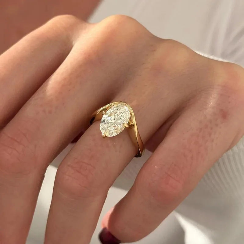 Curved-band oval lab-grown diamond ring
