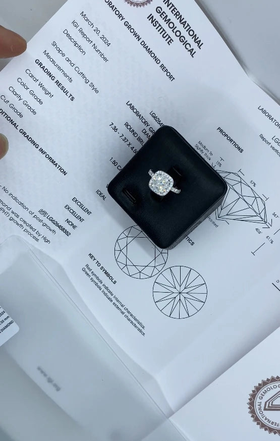 Lab-grown diamond halo ring featuring round center stone