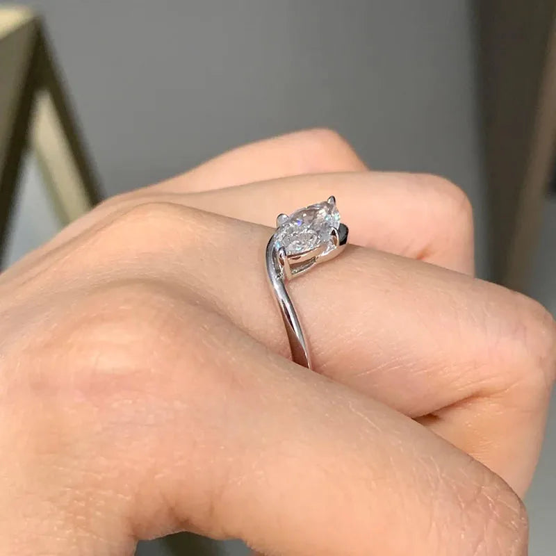 Gold twisting ring with marquise-shaped diamond
