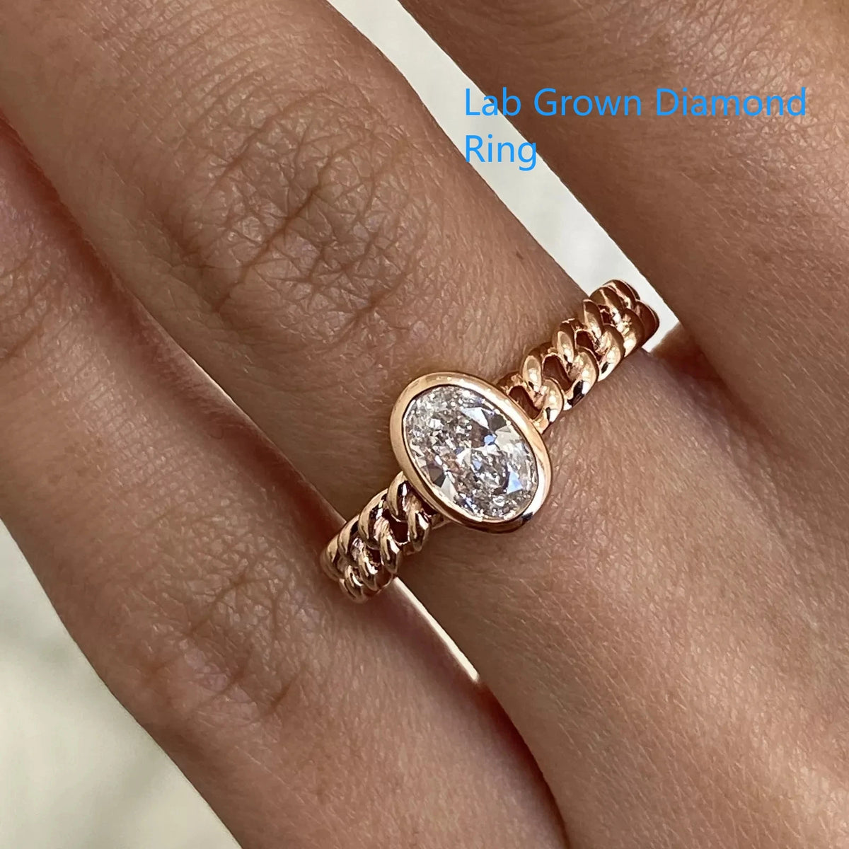 Oval-cut lab-grown diamond ring with clean bezel-style setting