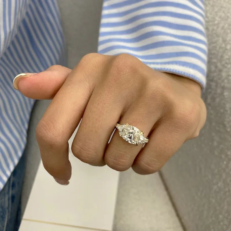 Marquise engagement ring with diamond-accented split shank