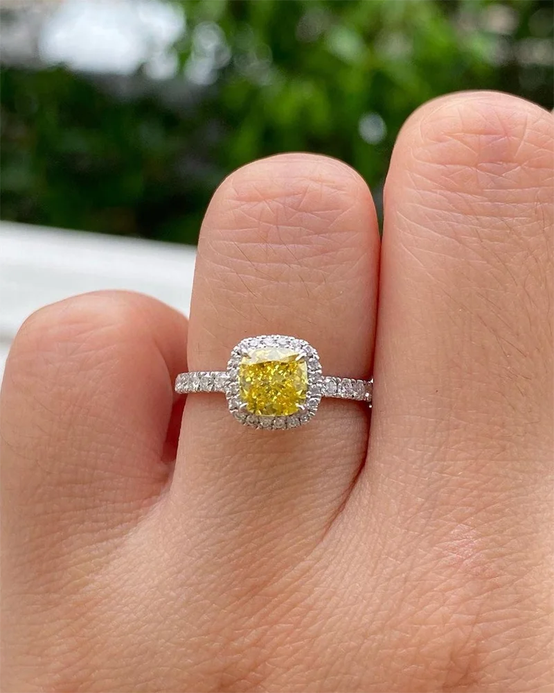 Yellow lab-grown diamond engagement ring with accent stones