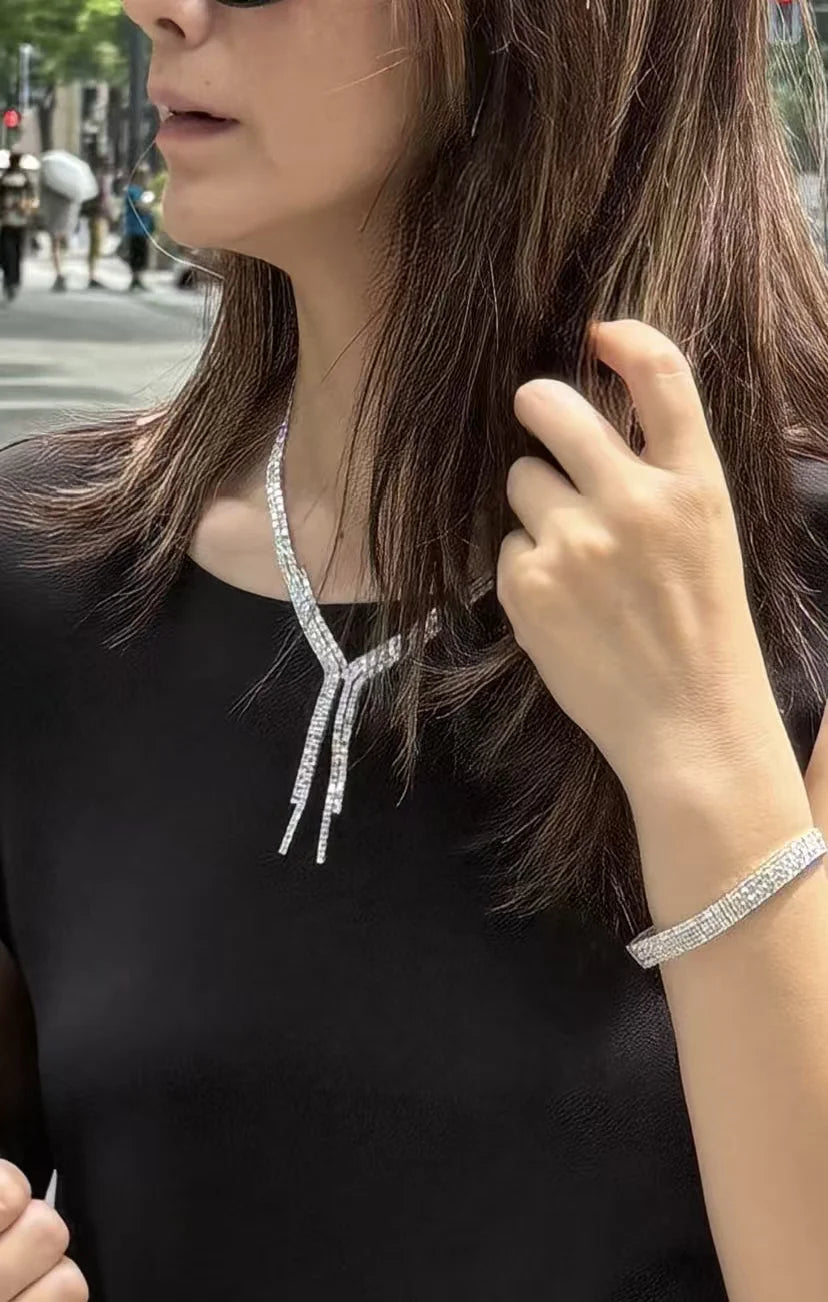Tennis necklace featuring emerald-cut diamonds