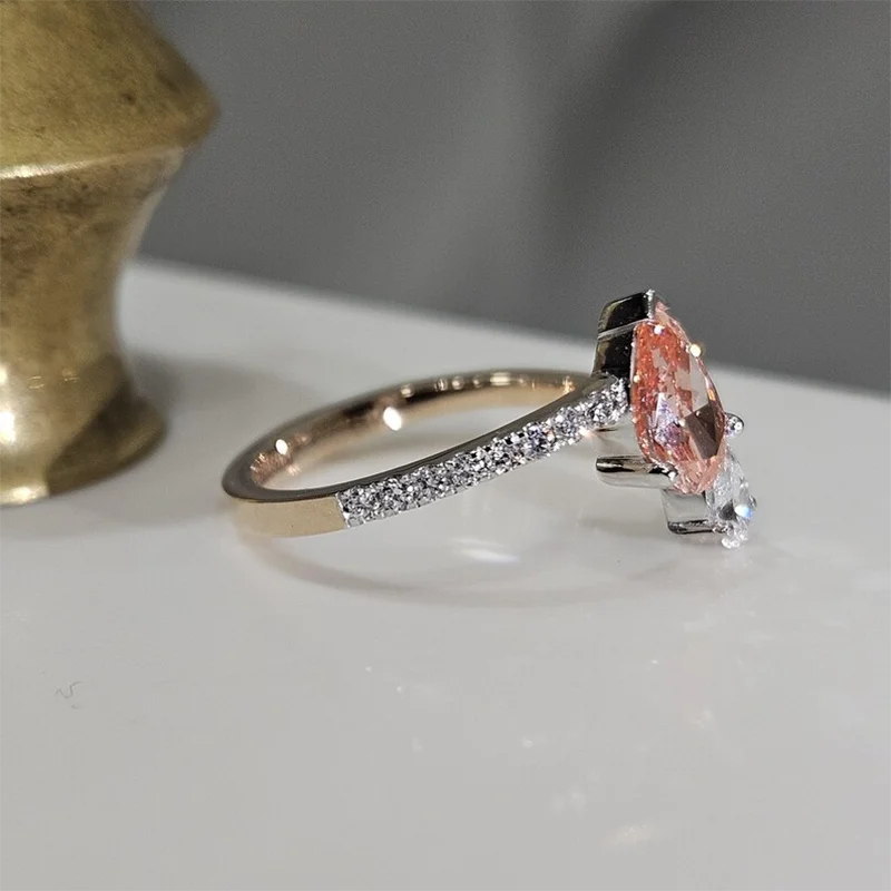 Two-tone gold ring with pink and colorless pear diamonds