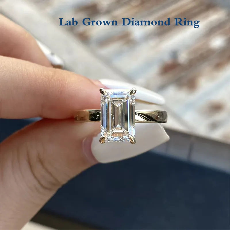 Three carat emerald-cut diamond ring in gold
