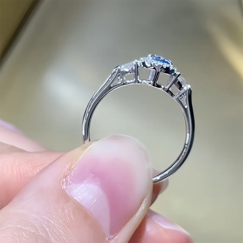 Blue pear-shaped diamond ring with two side stones