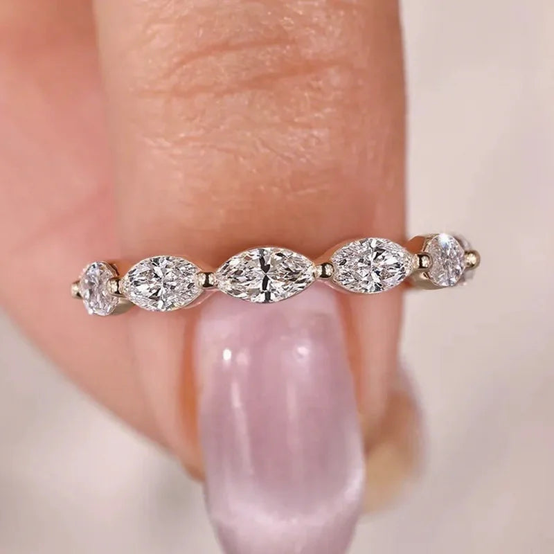 Marquise-shaped lab-grown diamonds across a band