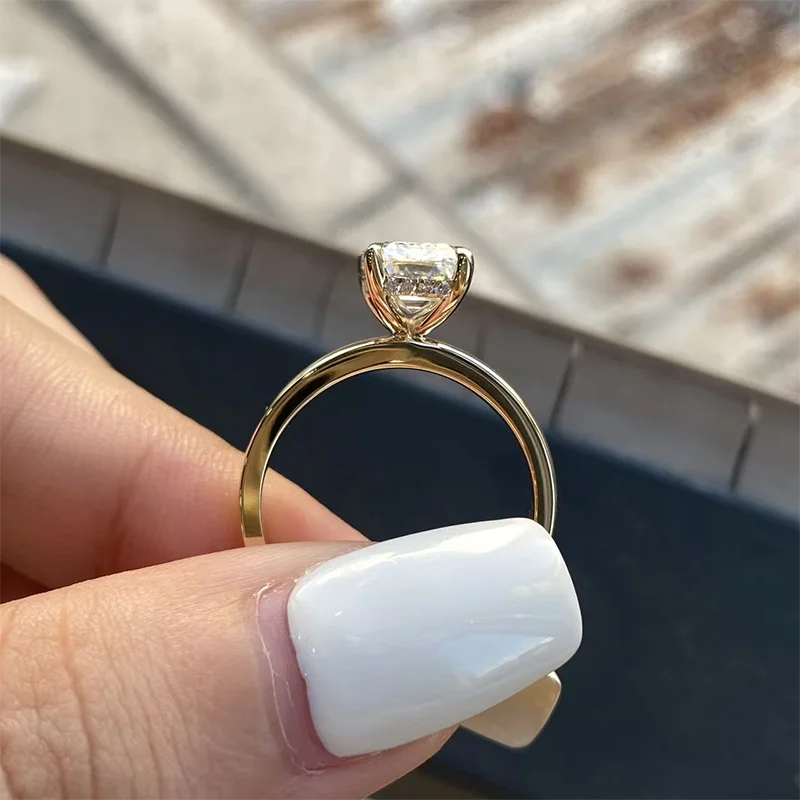 Gold wide-band emerald diamond engagement ring
