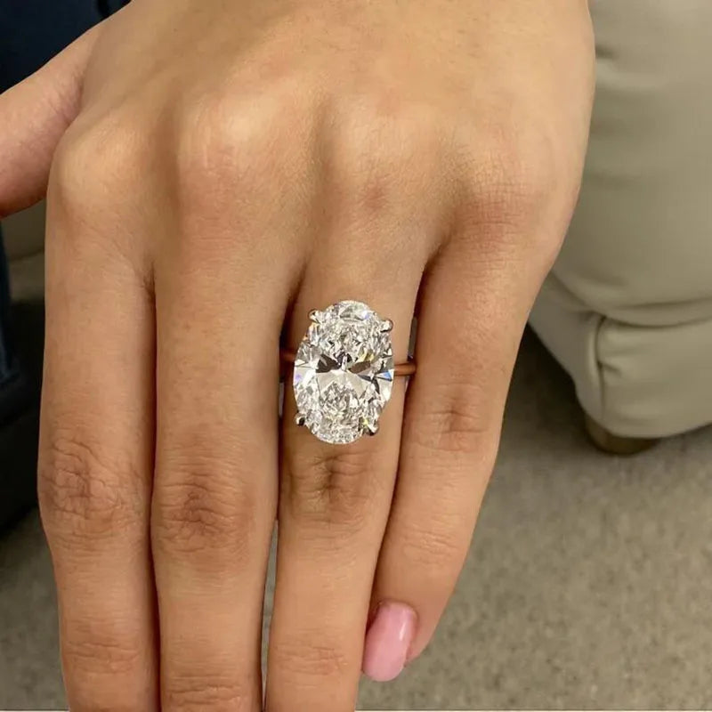Gold engagement ring with large oval diamond