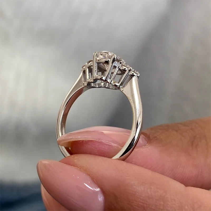 Gold oval lab-grown diamond ring with diamond-accented shoulders