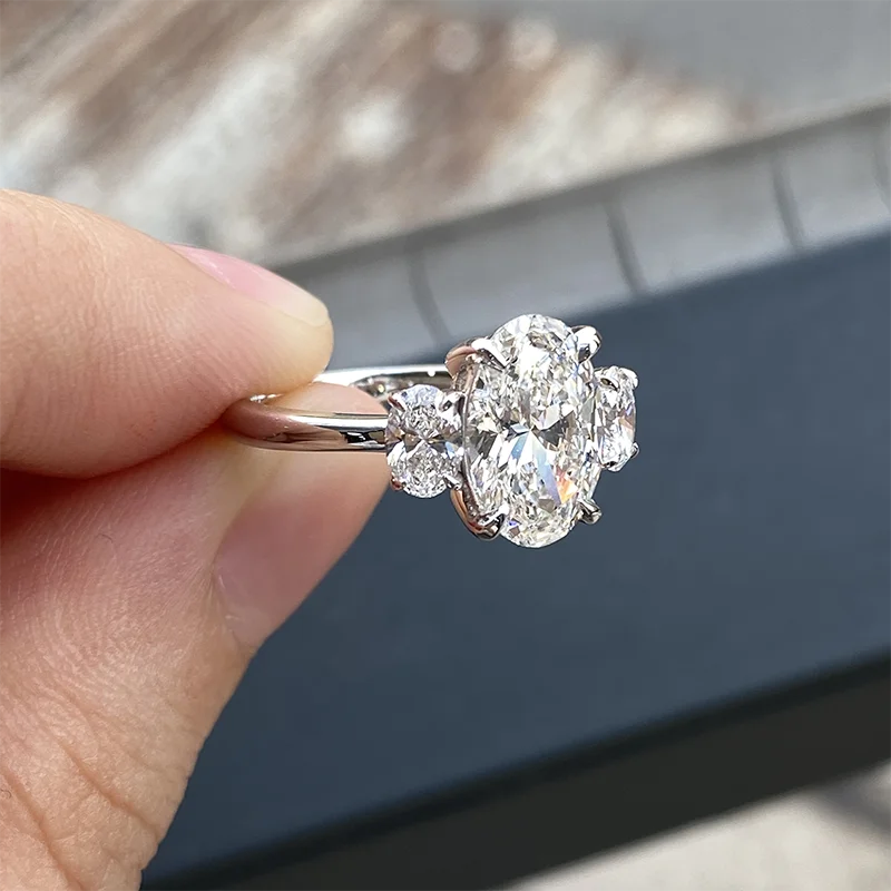 Three-stone oval lab-grown diamond engagement ring
