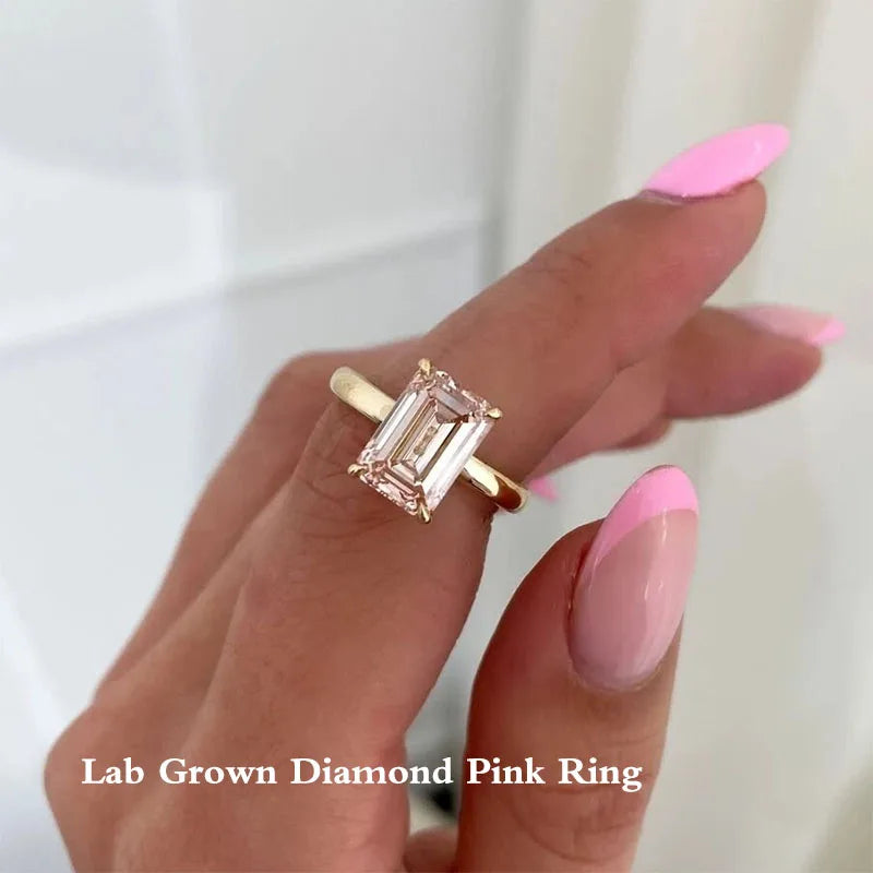 Gold ring with pink emerald-shaped diamond