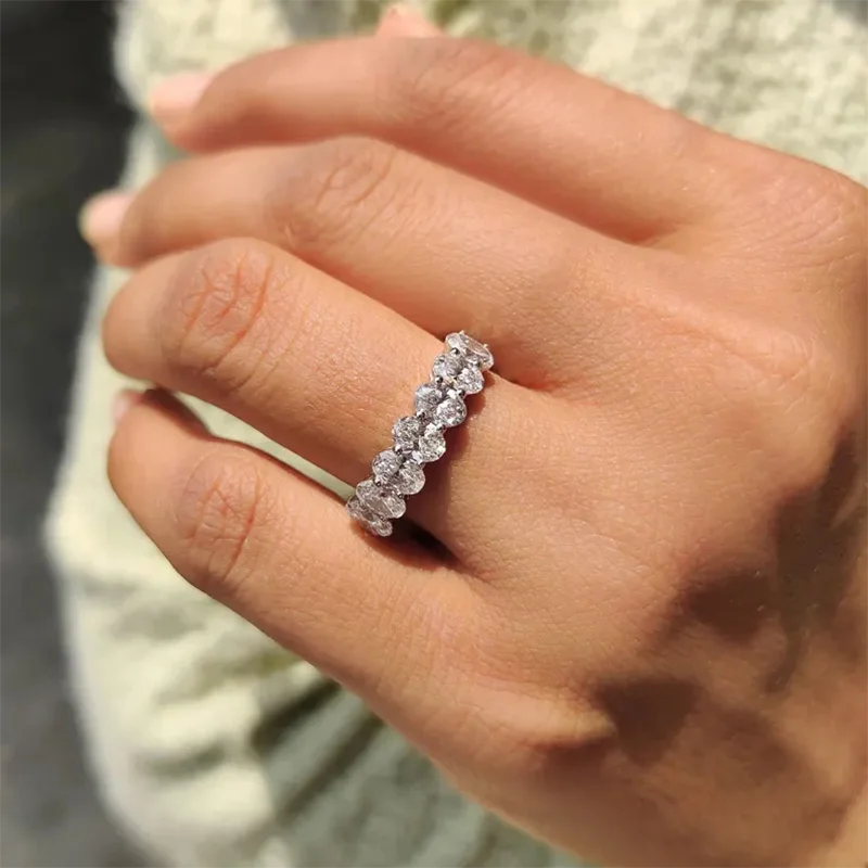 Ring band with seven oval lab diamonds