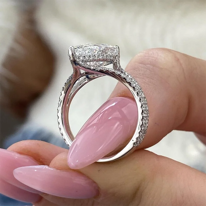 Gold pear diamond engagement ring with split shank