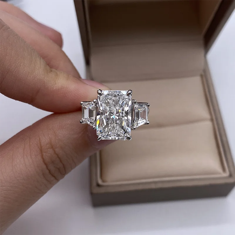 Three-stone diamond ring with radiant-cut centerpiece