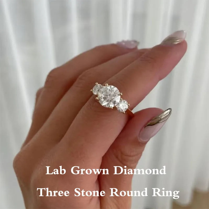 Round lab-grown diamond three-stone engagement ring in gold