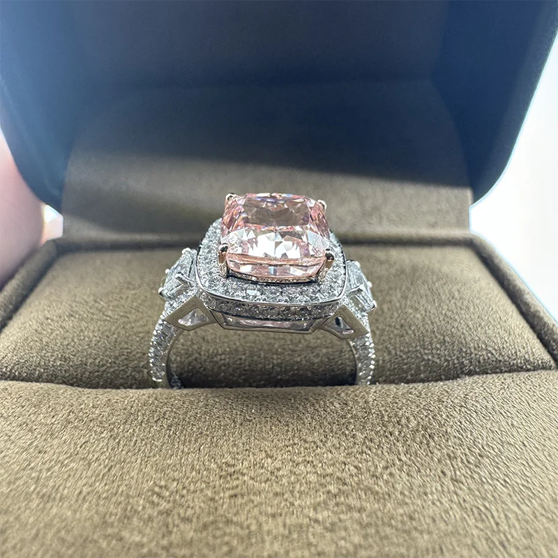 Pink cushion diamond engagement ring with side accents